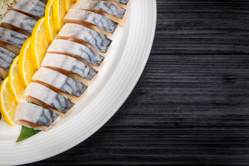 Herring fillets with onion and lemon slices