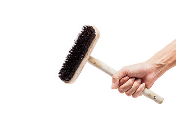 hand holding old wooden clean brush.