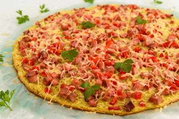 Pizza - the basis of zucchini, ham and paprika. Healthy food. The top view