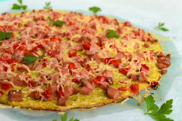Pizza - the basis of zucchini, ham and paprika. Healthy food. The top view