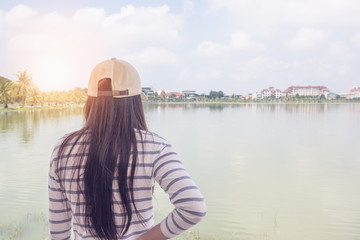 Fototapeta premium Woman standing and looking on the lake.