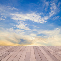 Fototapeta premium perspective wood plank floor on sunset sky sea with reflex backg