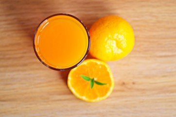 Orange juice drinks on a wooden background with fresh oranges fruits. Juice drinks the way to get healthy life.
