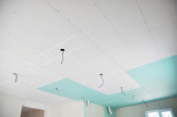 Ceiling construction details with electricity wire for lighting. Building gypsum plaster boards, walls and ceiling. Ceiling Joists of Home Under Construction. Using Gypsum Board for Ceilings Section.