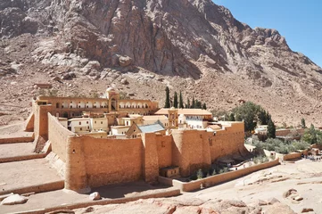 Fotobehang Beautiful Mountain cloister landscape in the oasis desert valley. Saint Catherine's Monastery in Sinai Peninsula, Egypt © bildlove