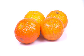 mandarins in the foreground on white background, isolated subject