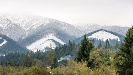 mountain tops in winter covered in snow