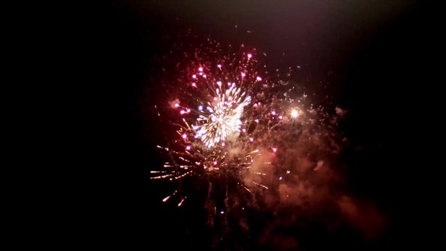 Fireworks at night in slow motion.