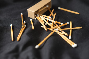 Wooden matches on dark background