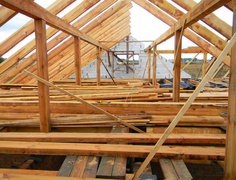 Attic Construction. Wooden Roof Frame House Construction.  Roofing Construction.