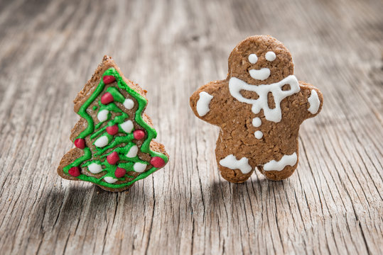 Gingerman and Christmas tree made of gingerbread dough as backgorund