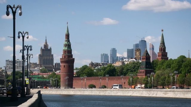 Moscow, Kremlin Embankment. Concrete Banks. Red Wall and Towers. Tall Modern Buildings. Historical Center.opposite River Side View. Summer