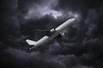 airplane under stormy sky