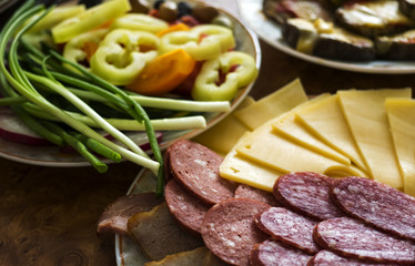 Slices of ham and cheese on plate