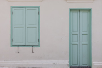 old window and door on color wall thai style.