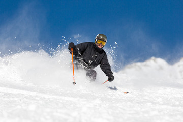 Fototapeta na wymiar Male skier skiing at ski resort