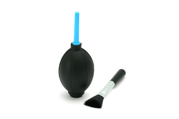 Silicone blower for camera and lenses with black cleaning brush isolated on white background