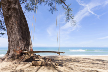 Swings on the tropical beach ,beautiful sand  scenery background