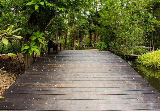 Wooden bridge path in park © naviya