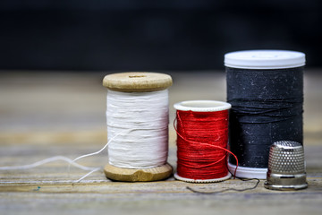 Sewing thread black and white  red color