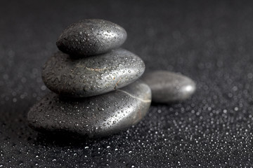 Dewy stones on black background