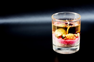 candle in glass on dark background