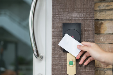 Door access control with a hand inserting key card to lock and u