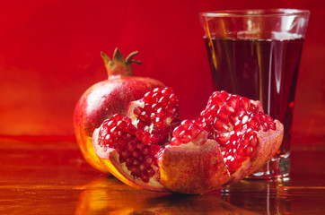 red and fresh pomegranate on a  background