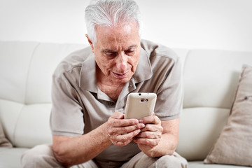 Senior man with smartphone.