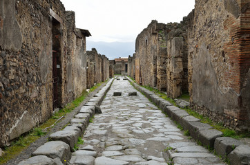 Fototapeta na wymiar Restored street in the ancient Pompeii