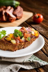 Bruschetta with tomato, pepper, onion and bacon
