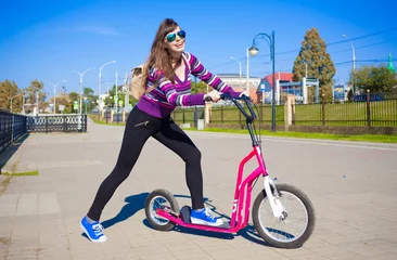 Foto op Plexiglas  Kick scooter, black leggings, striped sweater, backpack, full h © erainbow