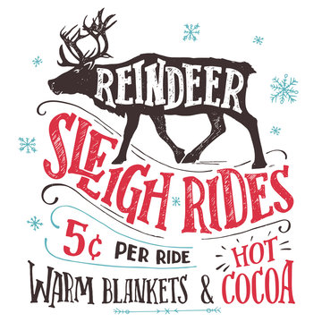 Old fashioned reindeer sleigh rides signboard. Hand-lettering advertising sign. Vintage hand drawn typography with the silhouette of a reindeer isolated on white background. Winter entertainments
