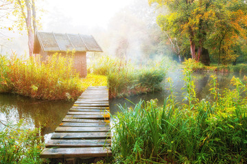 Bridge leading to small hut © oliverleicher