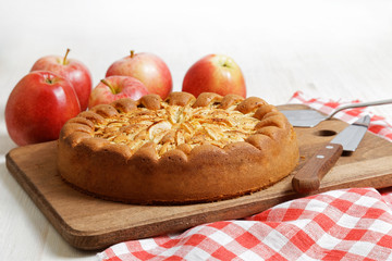 Homemade apple pie on white table