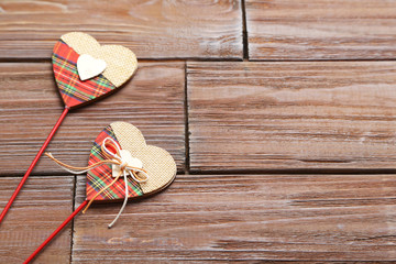 Love hearts on a brown wooden table