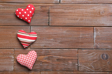 Love hearts on a brown wooden table
