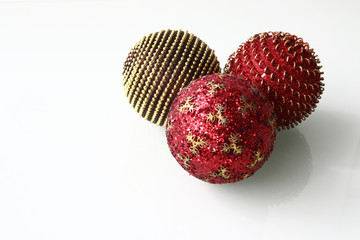 shiny Christmas baubles red and golden with glitter