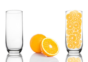 Glass of healthy organic oranges inside on white