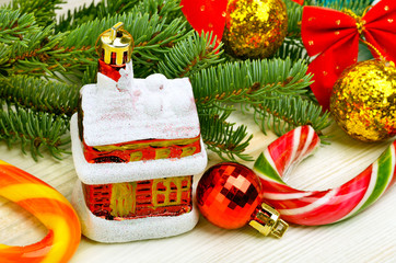 Christmas baubles, pine twig,  pine twig and lollipops.