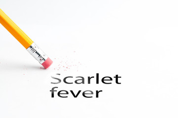 Closeup of pencil eraser and black scarlet fever text. Scarlet fever. Pencil with eraser.