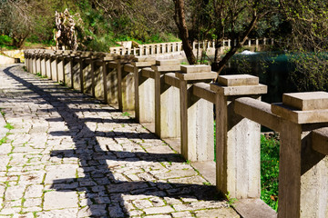 Naklejka premium Ancient stone promenade with stone railing in New Athos Abkhazia