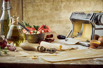 Obraz na płótnie Canvas Gourmet pasta making theme with tomatoes