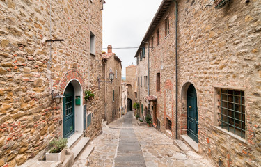 The narrow street in the historic center of Castiglione della Pescaia, Tuscany, Italy
