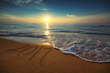 New Year 2017 concept on the sea beach