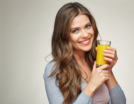woman face portrait with orange juice glass.