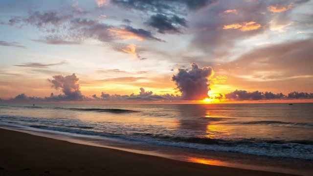 Sunrise over the Indian ocean at Arugam Bay in Sri Lanka. Time-lapse of moving clouds and waves. Popular touristic summer resort
