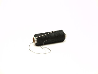coil and a needle on a white background