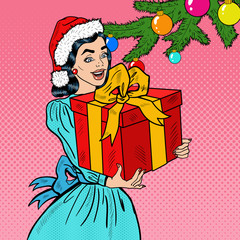 Pop Art Young Happy Woman Holding Christmas Gift Box. Vector illustration