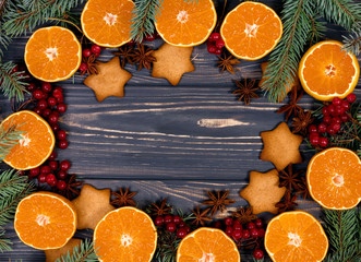 Christmas background. Mandarins, gingerbread and Christmas tree